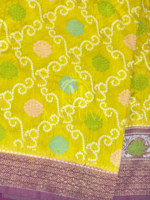 Elegant Yellow Banarasi Bandhani Silk Saree with Purple Floral Zari Border