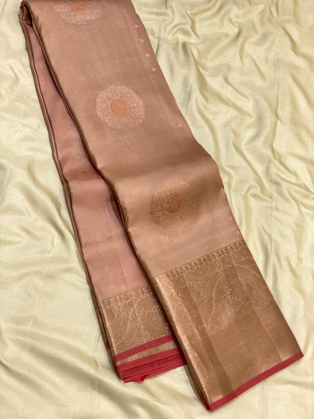 Elegant Peach Silk Saree with Zari Floral Motifs and Gold Border