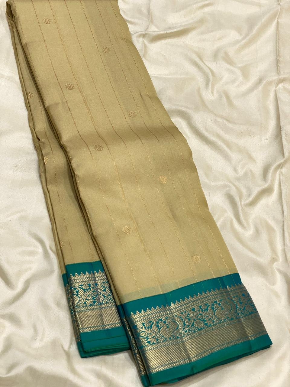 Elegant Cream Kanchipuram Silk Saree with Teal Blue Zari Border