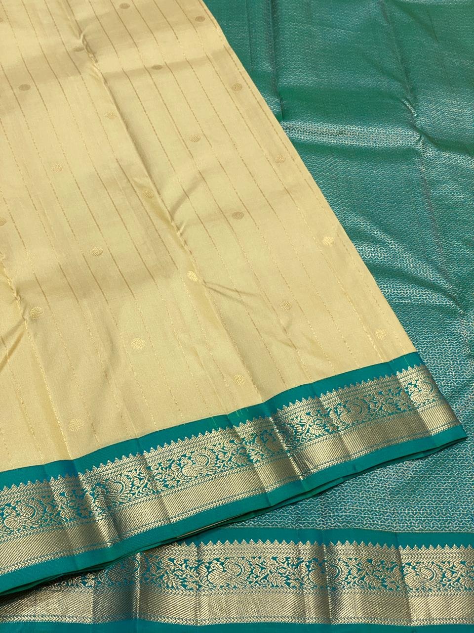Elegant Cream Kanchipuram Silk Saree with Teal Blue Zari Border